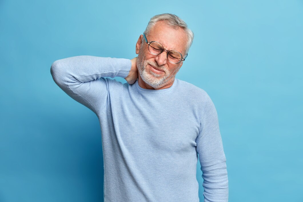 Exhausted man dealing with chronic aches and pains
