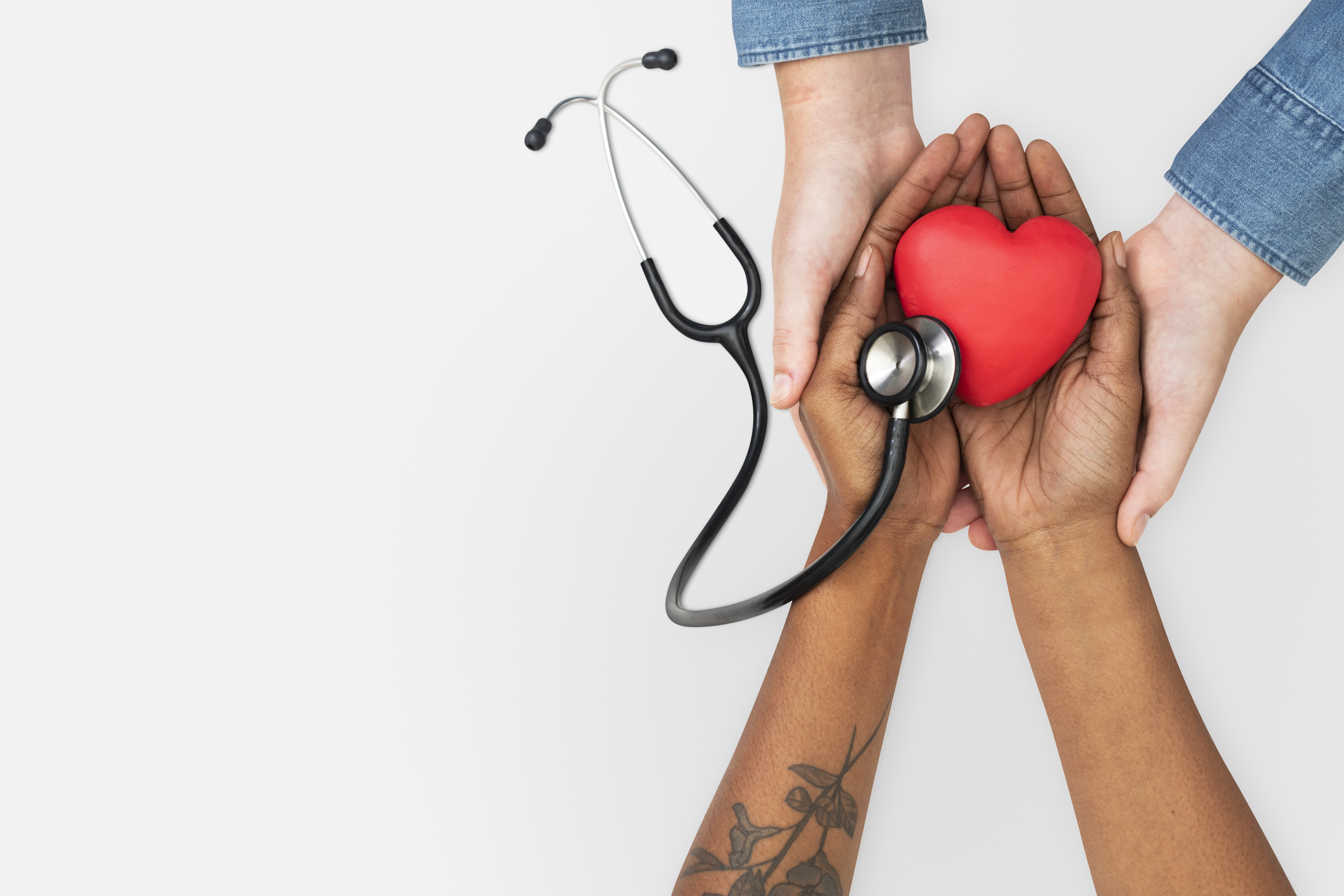 hands holding a heart and stethoscope