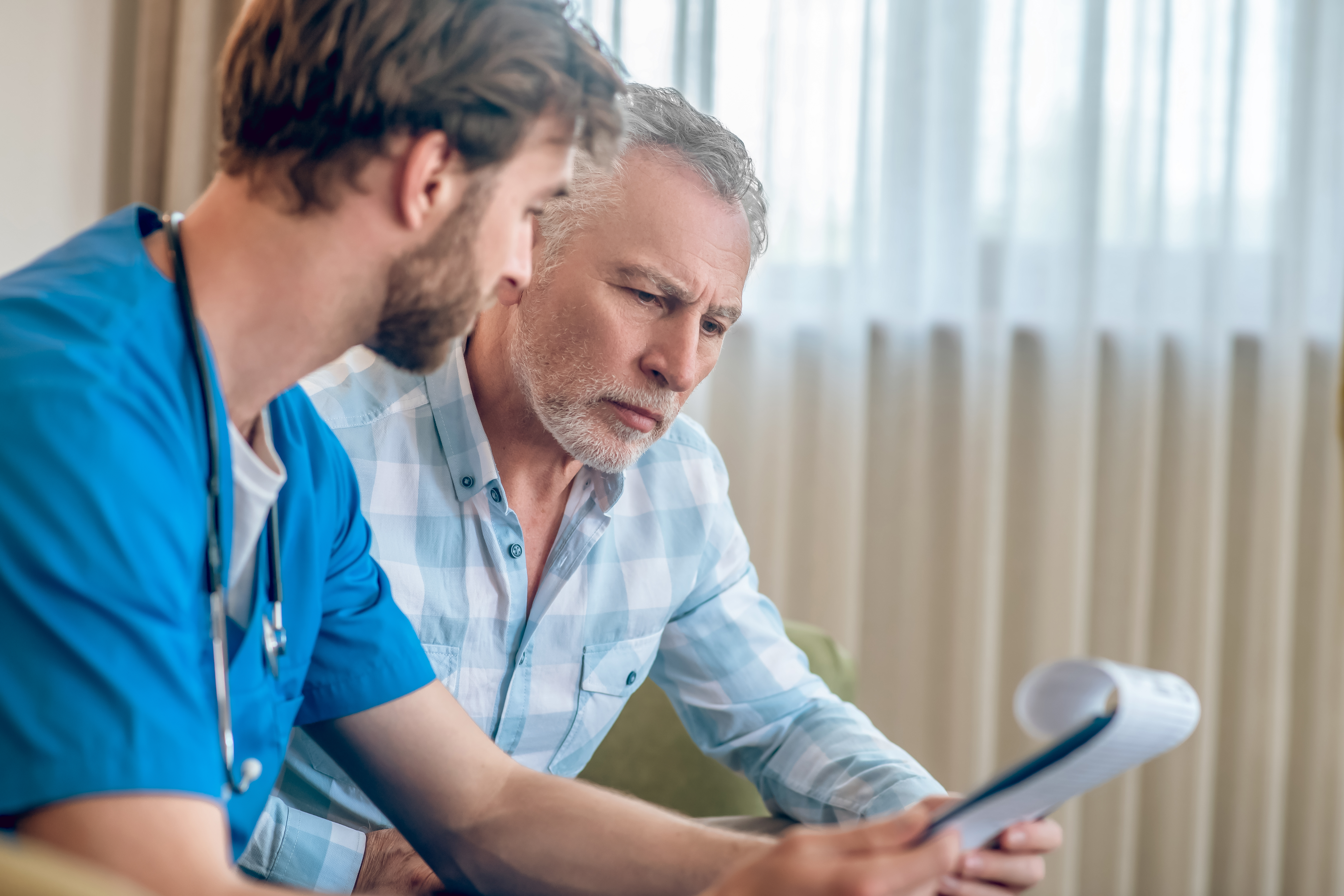 Man talking with his doctor