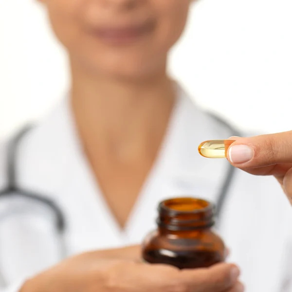 Pharmacist handing over supplements